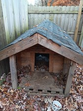 Custom made doghouse 2x4 porch. And 4x4 w inside windows and rood w shingles