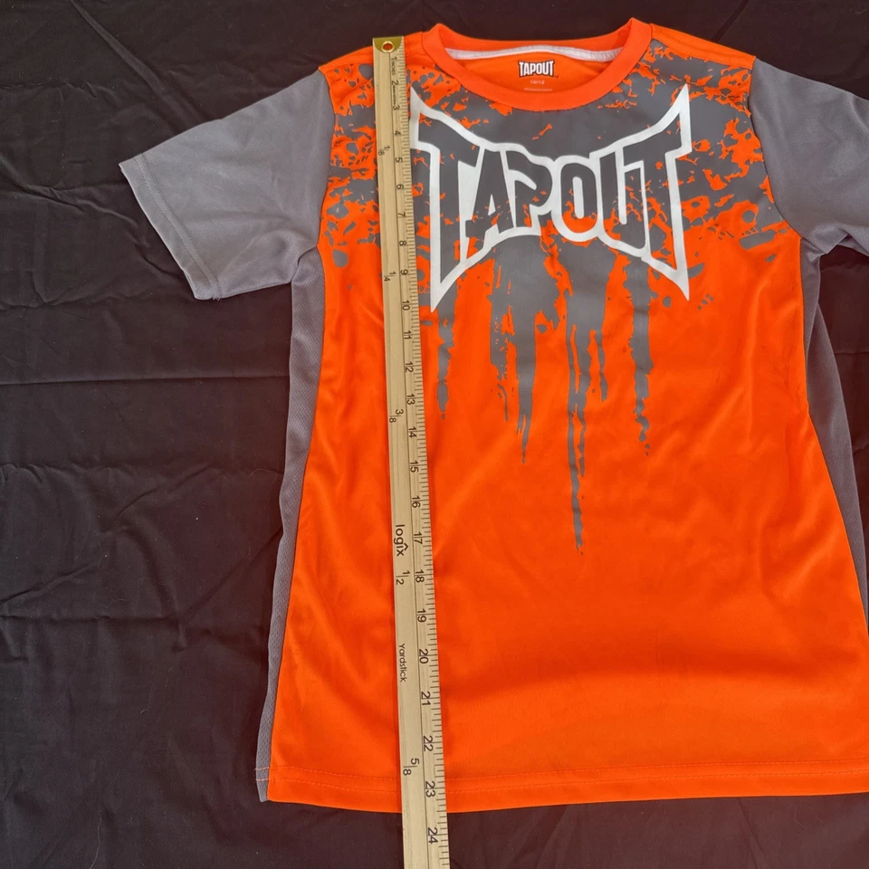 Camisa Tapout Manga Corta Niños Talla 10-12, Naranja/Gris Foto 4 de 4