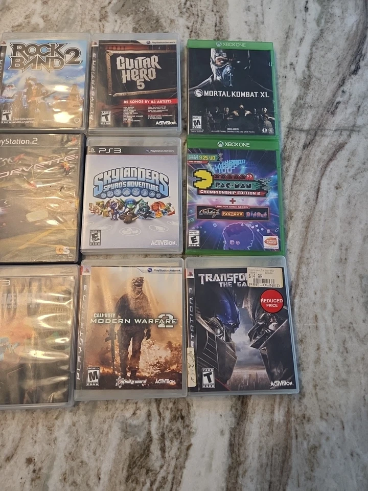 Lote 18 Juegos PS2 PS3 Xbox One COD Pac Man Guitar Hero Rock Band Lego Foto 2 de 4