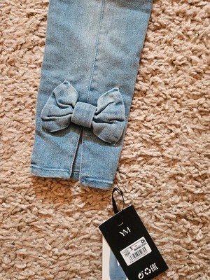 Damen Skinny Jeans mit Schleife hinten unten