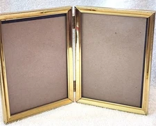Vintage Double Hinged Metal Gold Tone Picture Frame holds 5x 7 Pictures MCM