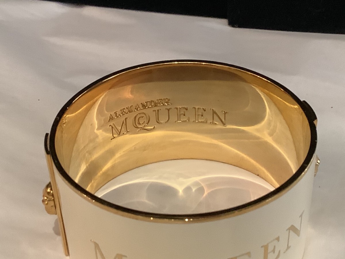 AUTHENTIC SIGN ALEXANDER McQUEEN GOLD TONE & WHITE ENAMEL SKULL