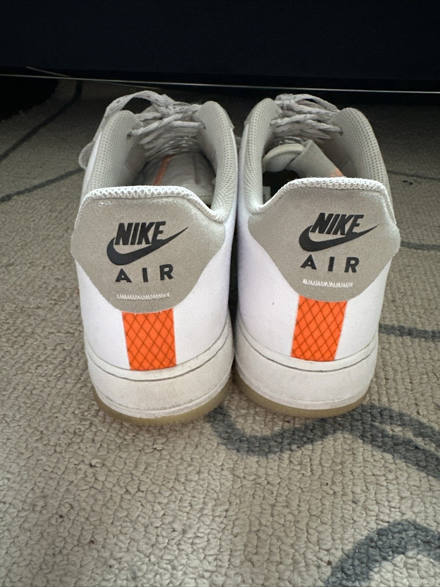 white nike trainers orange tick