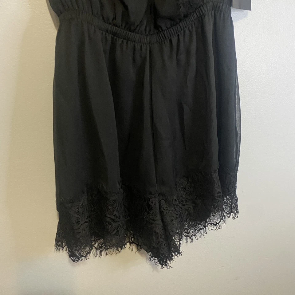 Mameluco Bebe nuevo con etiquetas sin mangas con ribete de encaje talla pequeña negro cintura elástica Foto 3 de 4