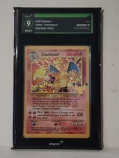 2021 Pokémon Celebrations Charizard Holo #4 professionally graded Degree 9 Mint.