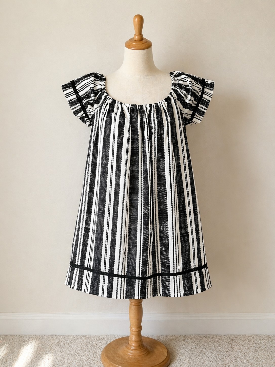 Girls Xhilaration black and white striped dress in size Medium.