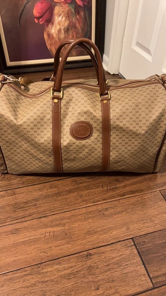 Borsone Gucci in tela con monogramma e bordo in pelle