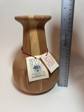 This handmade aromatic cedar wood vase, crafted in Maine