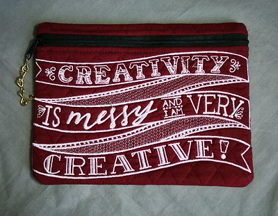   Custom embroidered small pouch. Burgundy with tinted white letters, clutch