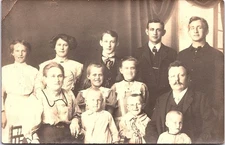 Large Family Group Studio Portrait, Men Women Children RPPC Postcard