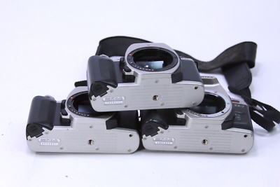 Lot of 3 Pentax ZX-M (2) & zx-7 (1) 35mm Camera bodies - Power on