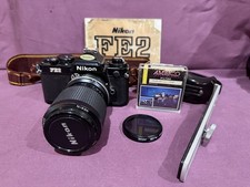 Nikon FE2 35mm Camera 35 105 mm Nikkor Lense Filters EXTRAS Manual Untested