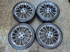 4x VAUXHALL ADAM 17" 7J ET44 4-STUD 14-SPOKE GREY ALLOY WHEELS & TYRES 215/45/17