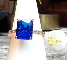 Ring Bomb Party Ring size 7 deep blue stone rose gold color band