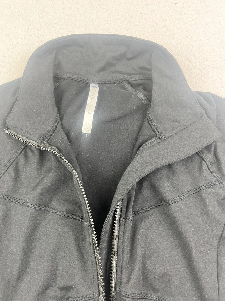 Chaqueta activa negra para mujer Fabletics bolsillos con cremallera talla mediana Foto 3 de 4