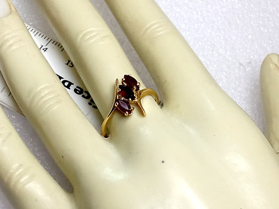 10K YELLOW GOLD 3-3 X 6MM MARQUISE GARNET  BYPASS RING SIZE 7.5, 2.1G