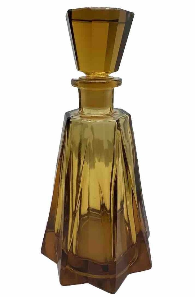 Rich amber Czech Art Deco decanter with that warm, jewel-toned glow that makes any bar cart look like it belongs in a Fitzgerald novel.