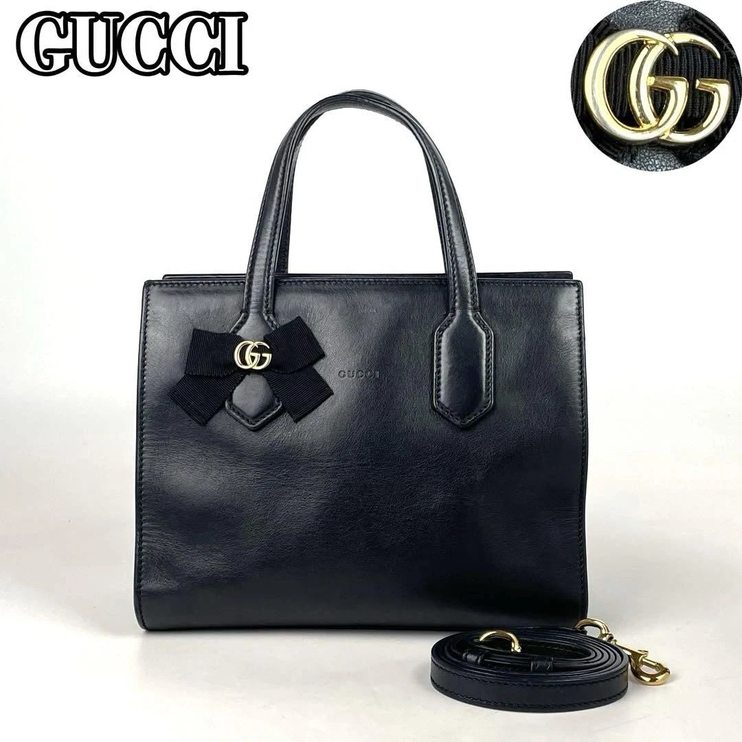 Sac à main Gucci Gg ruban 2 voies Marmont élégant fourre tout de luxe cuir noir doré