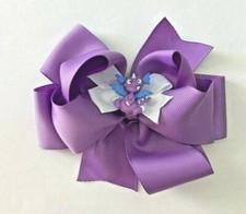 Beautiful Dragon Tales Purple Dragon  inspired hair bow for girls.
