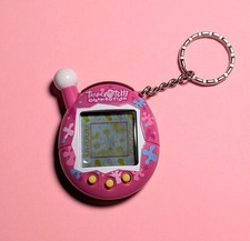   VTG original TAMAGOTCHI CONNECTION V4 Fuchsia Pink Blue PUZZLE PIECES/SPLATS