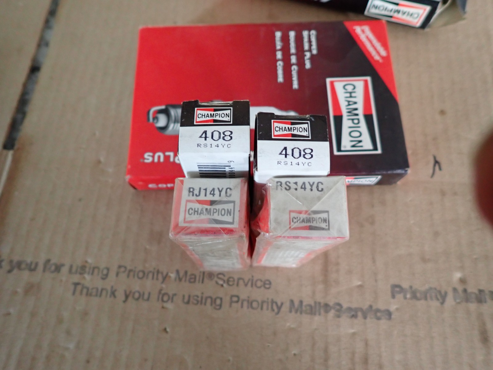 PKG. of 4 New Genuine Champion spark plugs RS14YC  FREE SHIPPING