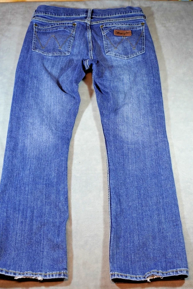 Pantalones de mezclilla retro Wrangler para hombre 33x34 se adapta a 34x33 azul bota ajustada bigote occidental Foto 4 de 4