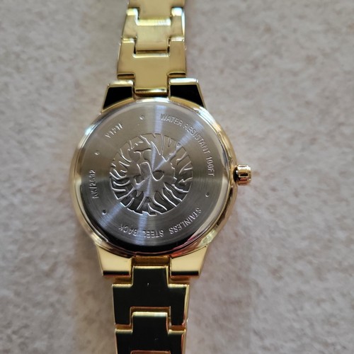Anne Klein Women's AK/2692 Diamond-Accented Gold-Tone and White Ceramic Brac - Picture 6 of 7
