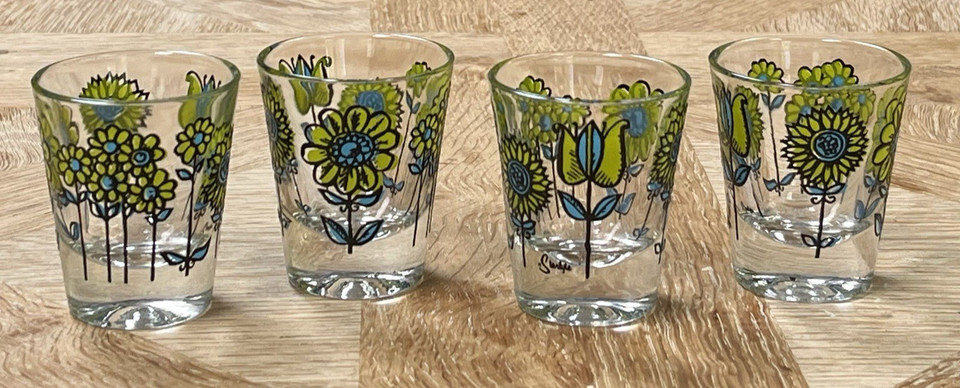 Genuine MCM Flower Power daisy shot glasses that look like they escaped a 1960s cocktail party — pure groovy nostalgia.