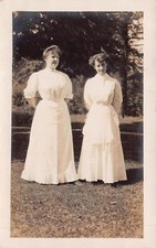 TWO WOMEN-FANCY WHITE DRESSES-MESSAGE IN SWEDISH~REAL PHOTO POSTCARD