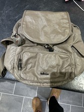 Kipling City Pack S or City Pack Mini backpack in a beige metallic finish.