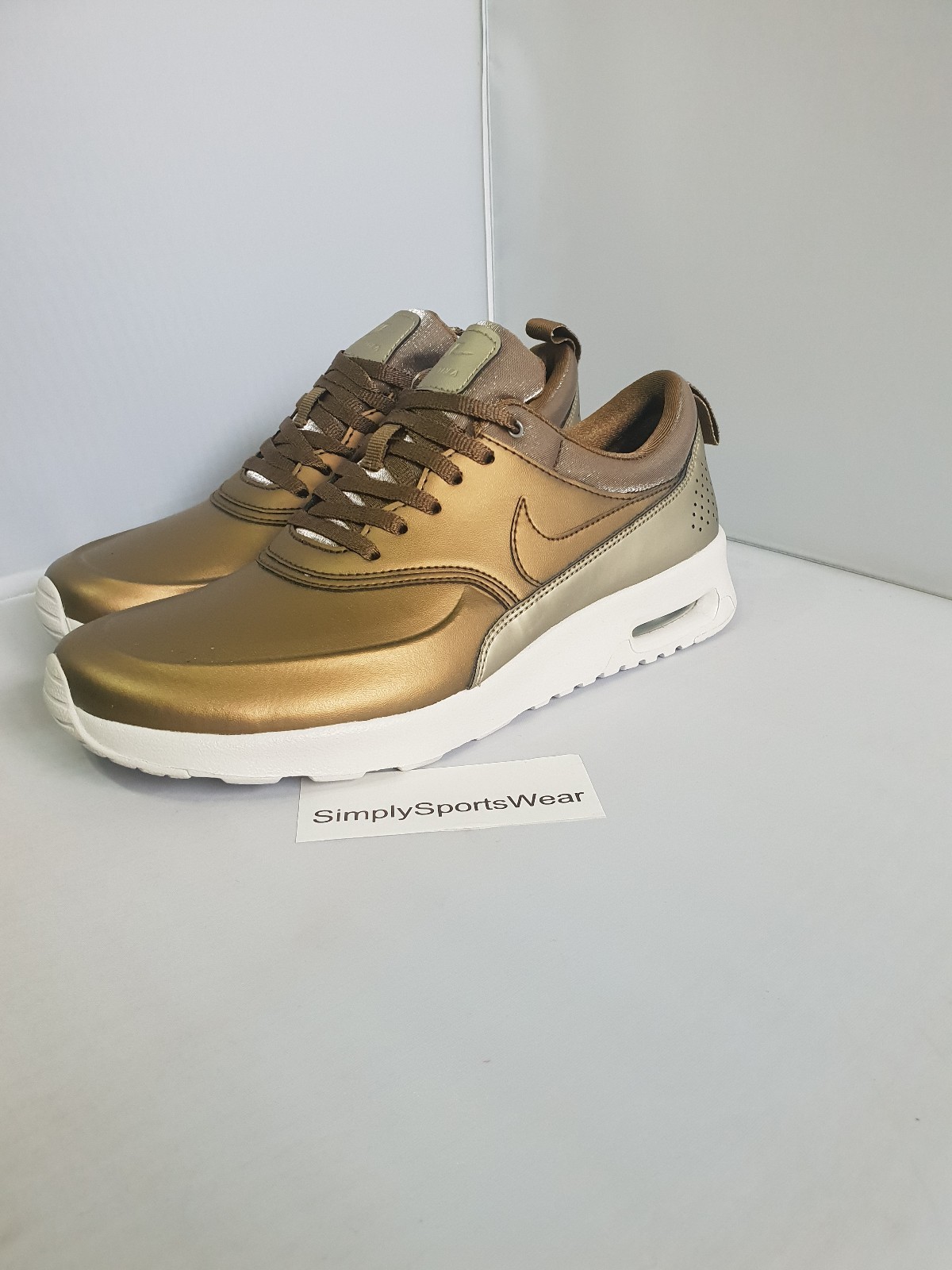 nike thea gold womens