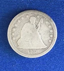 1862 Seated Liberty Quarter, a  Civil War year having VG details but porous.
