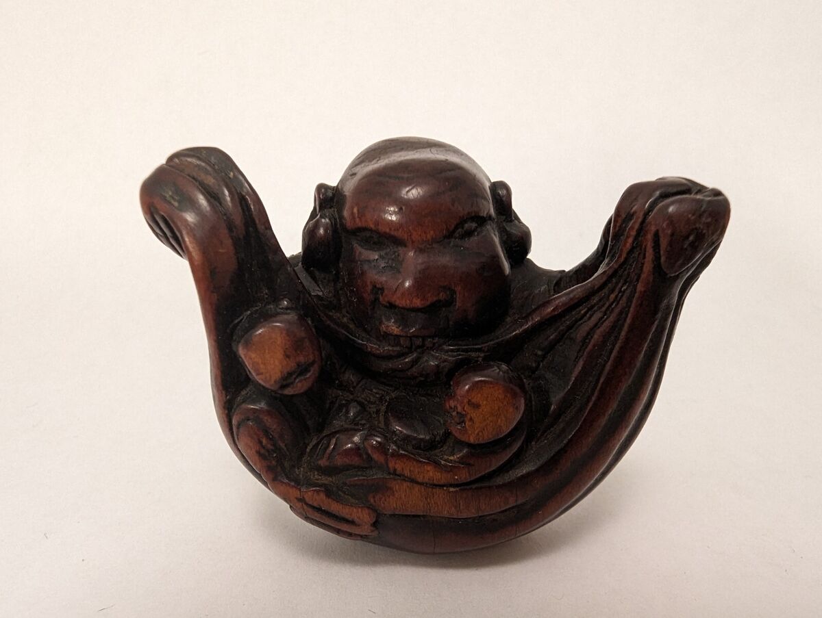 Antique Japanese Wood Netsuke Large Head Yokai holding bag Antique Japanese Wood Netsuke Large Head Yokai holding bag