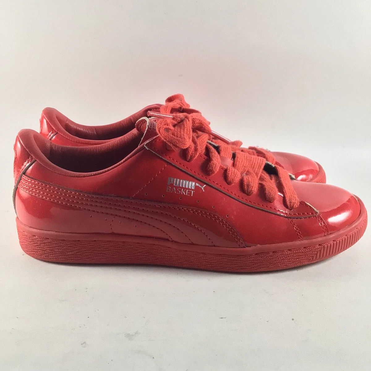 Red patent store leather pumas