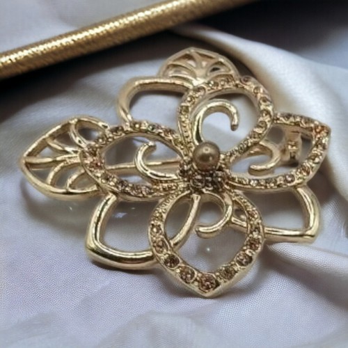 Monet Goldtone and crystal flower brooch,