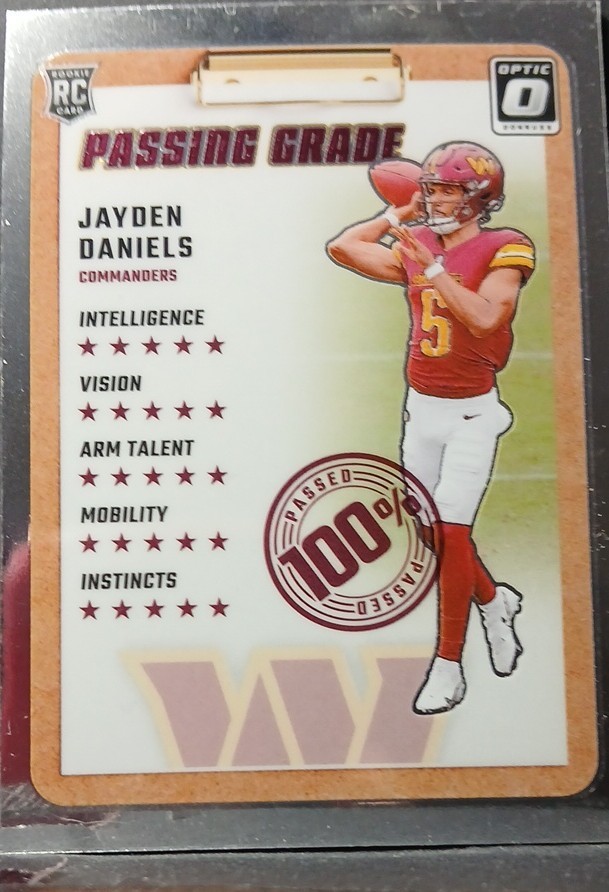 2024 Panini Donruss Optic - Passing Grade Jayden Daniels #2 (RC)