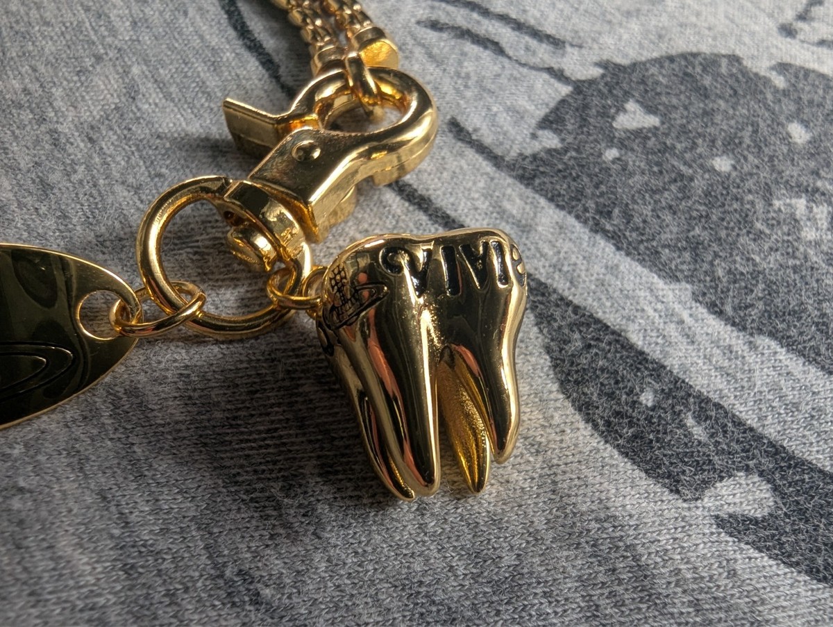 Vivienne Westwood Gold Chained Bracelet with Orb Plate and Tooth