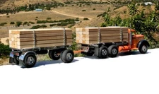 SMITH MILLER LUMBER  TRUCK IN BLACK AND ORANGE  NEW IN THE BOX.