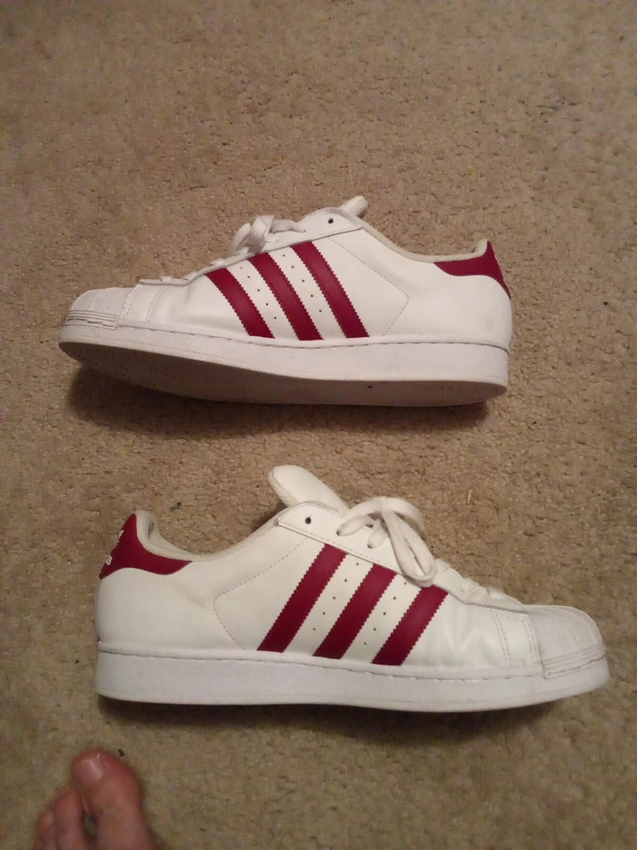 All red adidas superstar on cheap feet