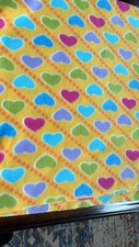 1 yard 18 inches Yellow with bright colored hearts fleece fabric.