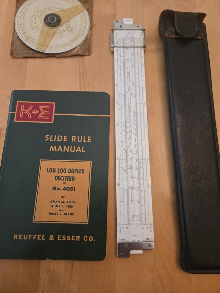 A K&E Doric slide rule by Keuffel & Esser — THE prestige American slide rule brand, complete with leather case and original manual.