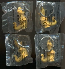 4 Tupperware Yellow Dinosaur Fun Flyer Keychains Douglass Dirtwalker Dragon New