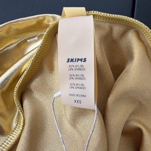 Traje de baño Skims mini falda pareo para mujer talla XXS dorado metálico brillante - Imagen 3 de 4