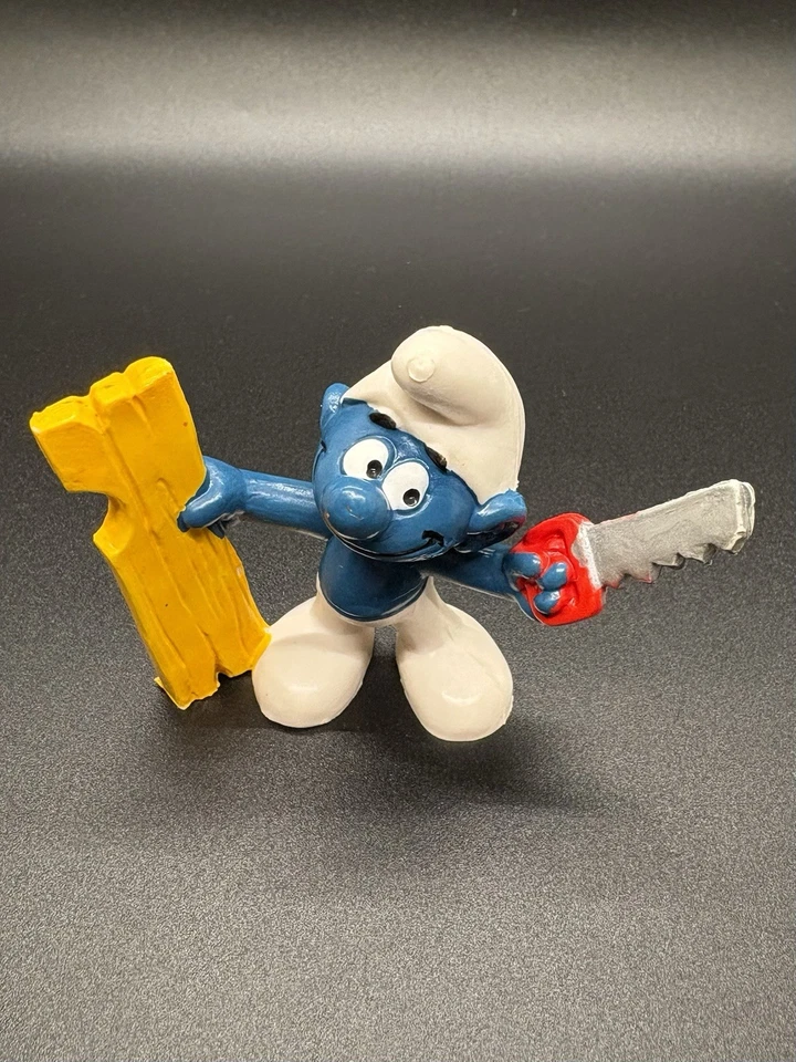 (B) Figura PVC de colección 1978 Schleich pitufo carpintero con sierra y madera Hong Kong Foto 2 de 4