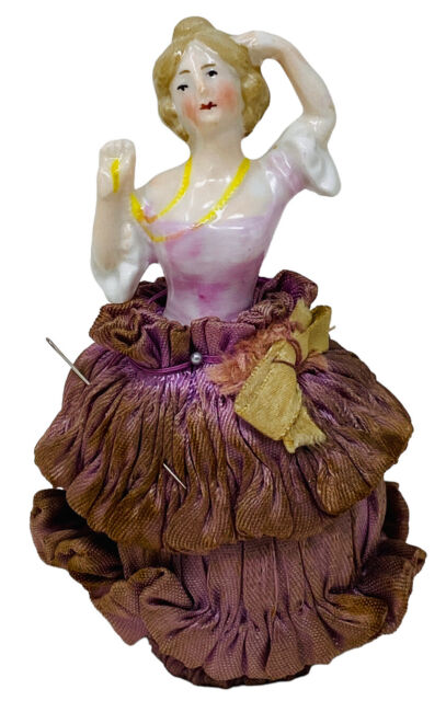 4-1/4” ANTIQUE PINCUSHON DOLL–PURPLE & YELLOW GERMANY ATTACHED TO SPOOL 4-1/4” ANTIQUE PINCUSHON DOLL–PURPLE & YELLOW GERMANY ATTACHED TO SPOOL