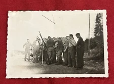 Soldiers Crowded Around Rifle WW2 WWII German Military photo Picture