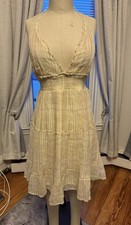 Cream and yellow plaid mini dress with tie back100% cottonSize Large