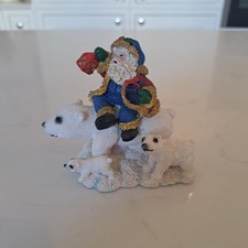 Father Christmas Santa Claus riding on a polar bear decoration ornament figurine