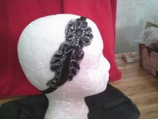 Pretty black headband with flowers outlined with tiny silver beads
