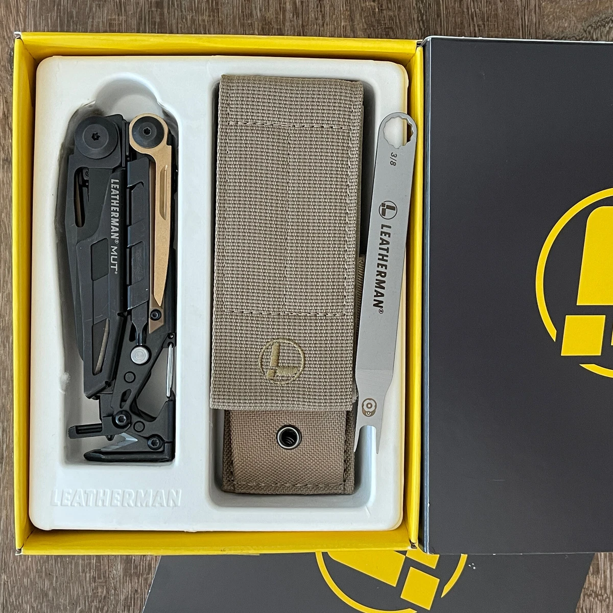 Leatherman MUT Black multi tool, brown molle sheath. Brand new